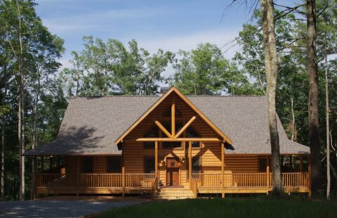 The image portrays a robust log cabin nestled amidst lush woodland, providing a perfect blend of rustic charm and nature's tranquility.
