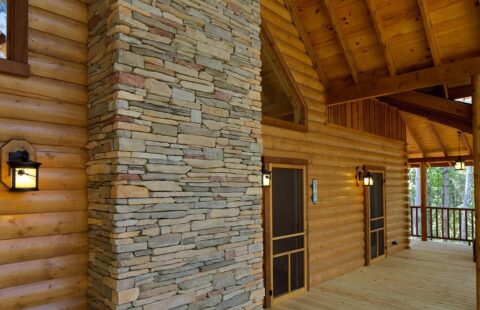 The image showcases a beautifully crafted front porch of our high-quality log cabin, exuding rustic charm and unparalleled durability.