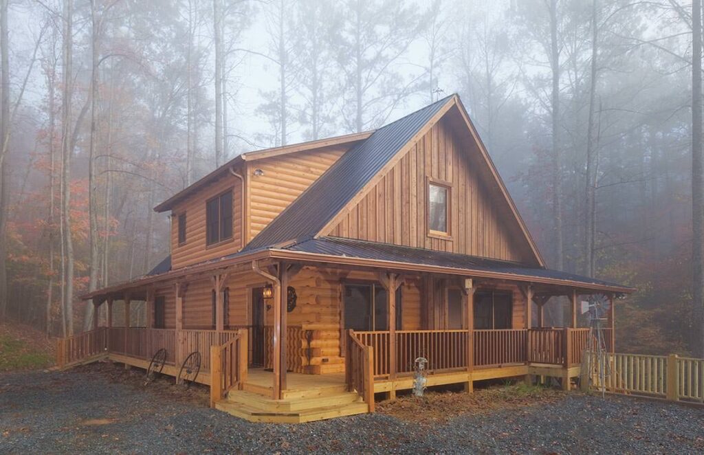 The image showcases a beautifully crafted log cabin nestled in the woods, featuring a welcoming porch.