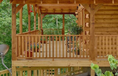 The image showcases a beautifully constructed wooden deck on one of our quality log cabins.