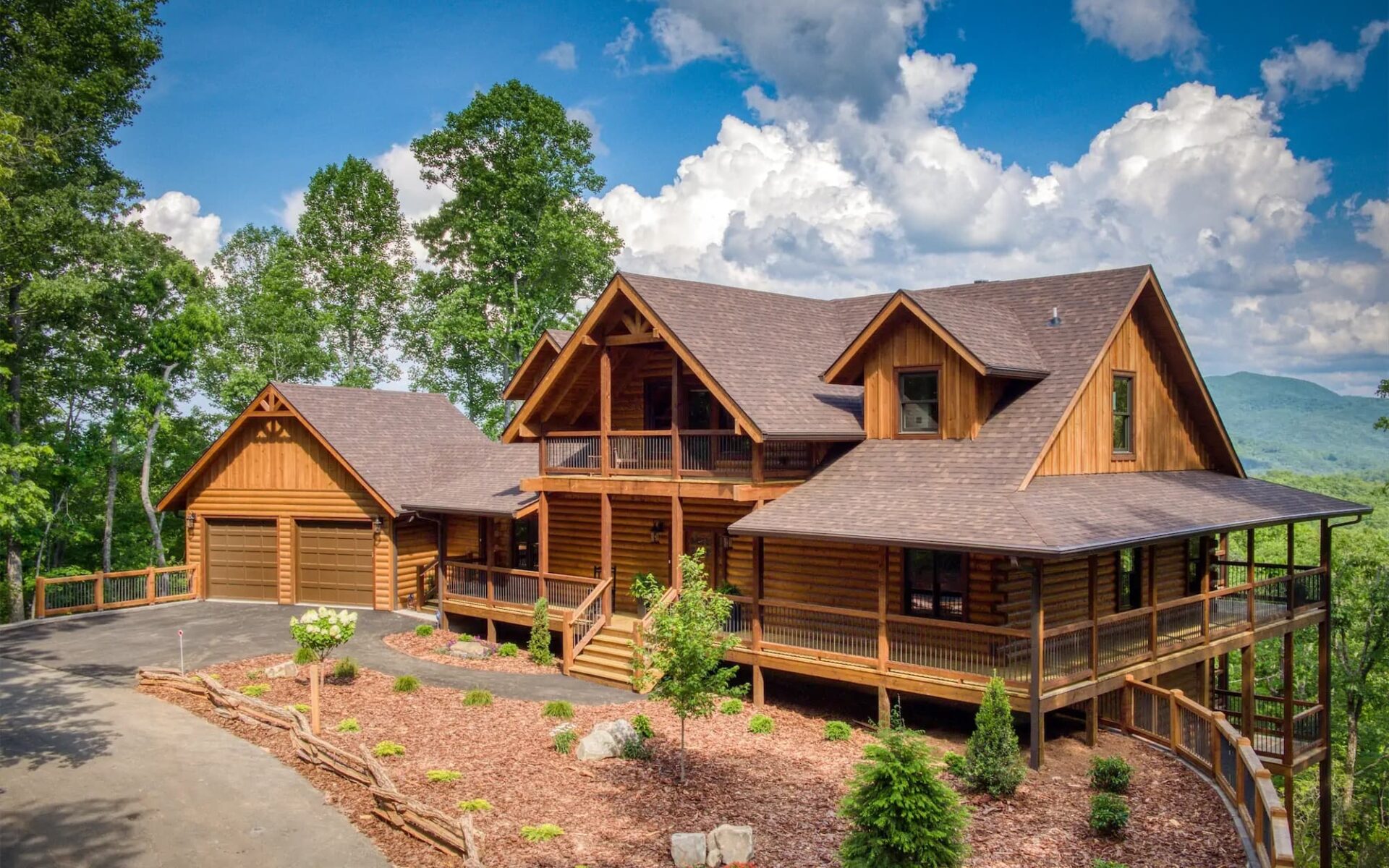 The image showcases a spacious, beautifully crafted log home nestled within a serene woodland setting.