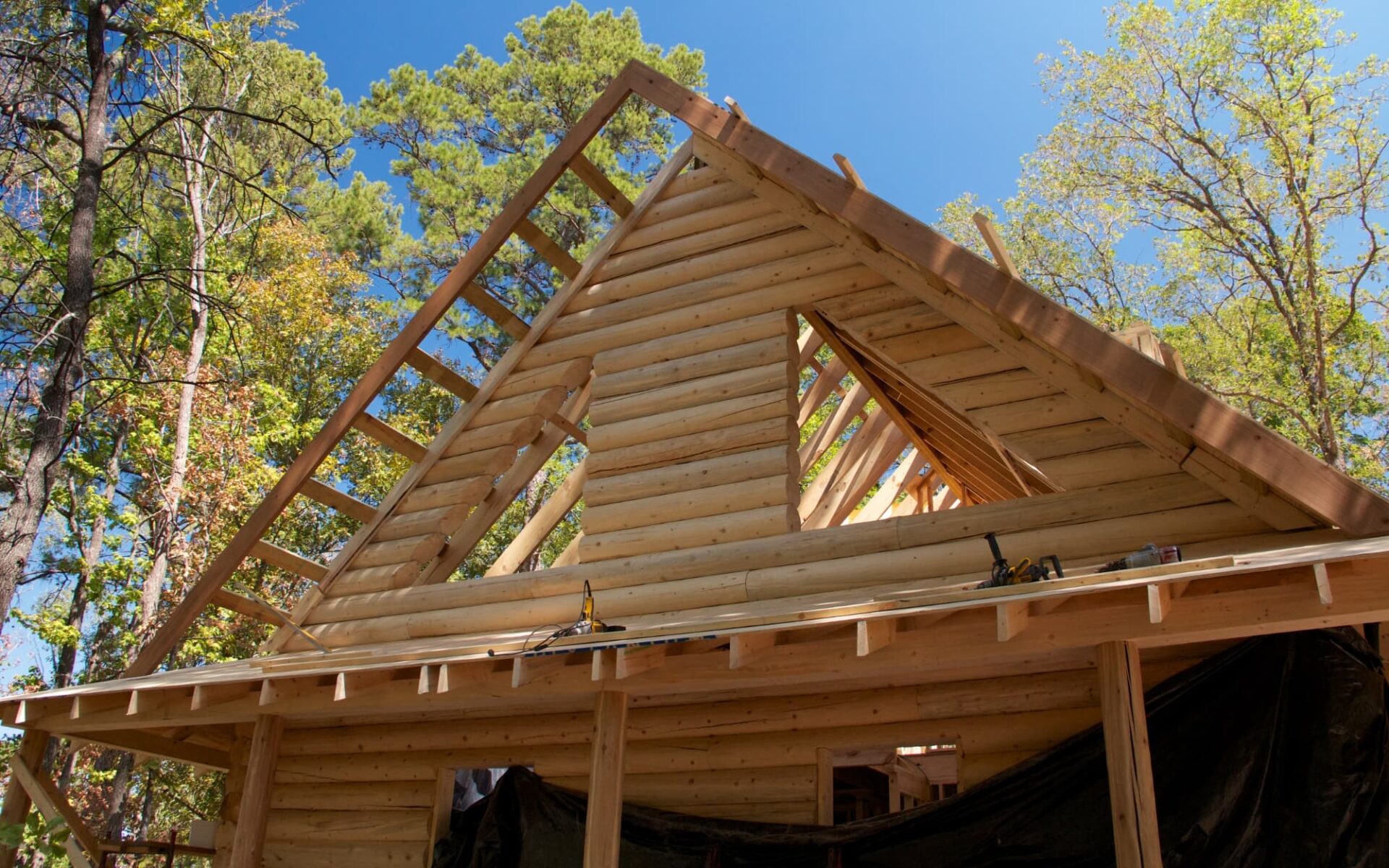 A log home by Satterwhite Log Homes is under construction.