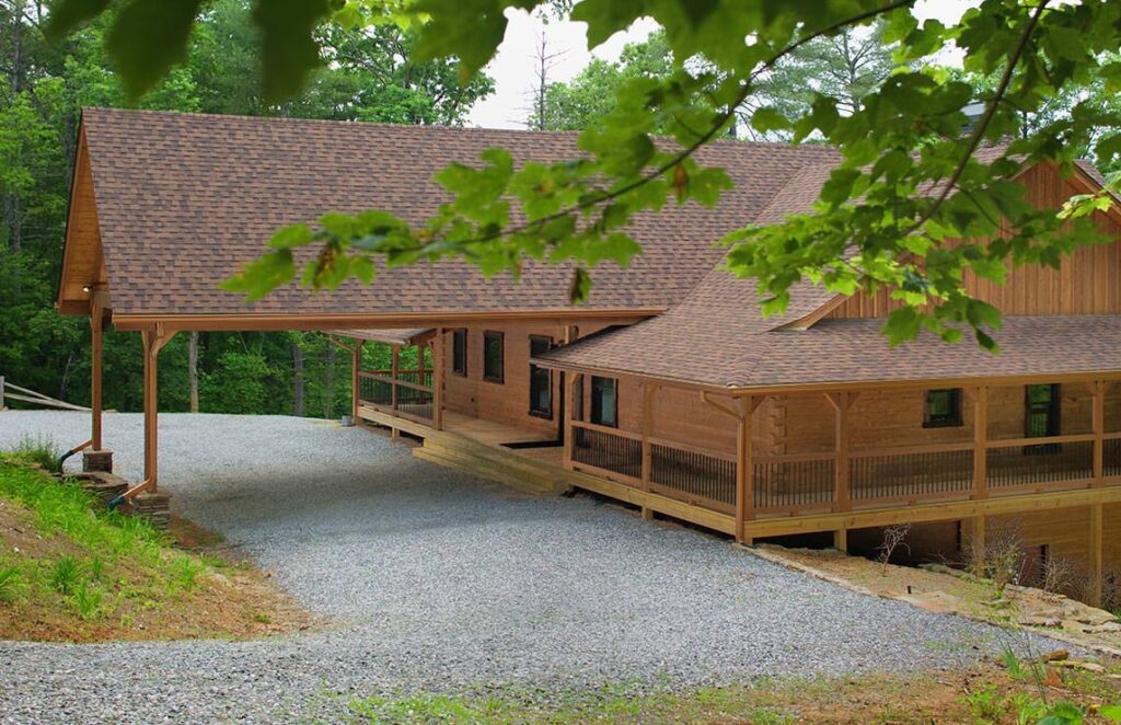 The image showcases a beautifully crafted log cabin nestled among lush woods, embodying tranquility and the simple charm of rustic living.
