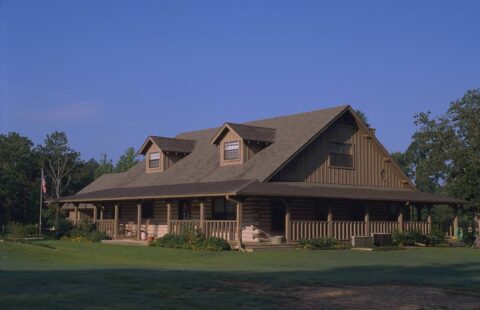 Our log homes feature a robust, brown-colored roof.